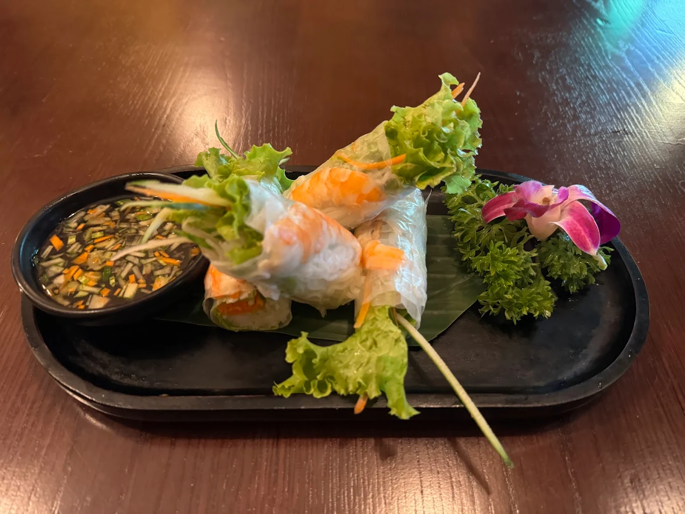 The vegetarian menu offers a variety of Vietnamese classics like fresh rolls, crispy spring rolls, fried rice, and vegan noodles that cater to many tastes 